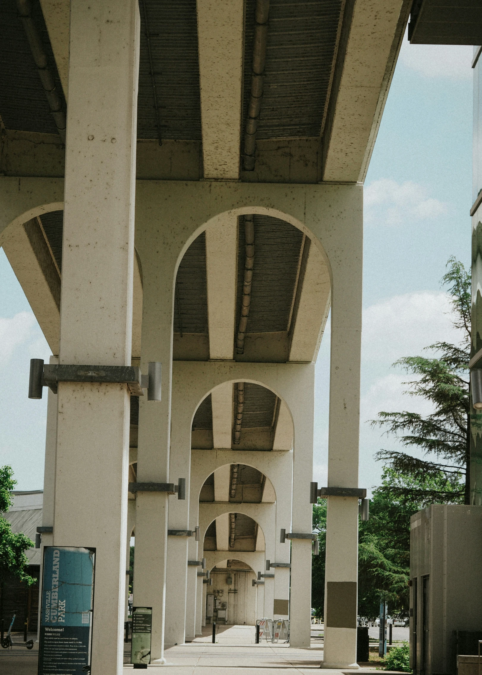 walkway under an overpass under a building