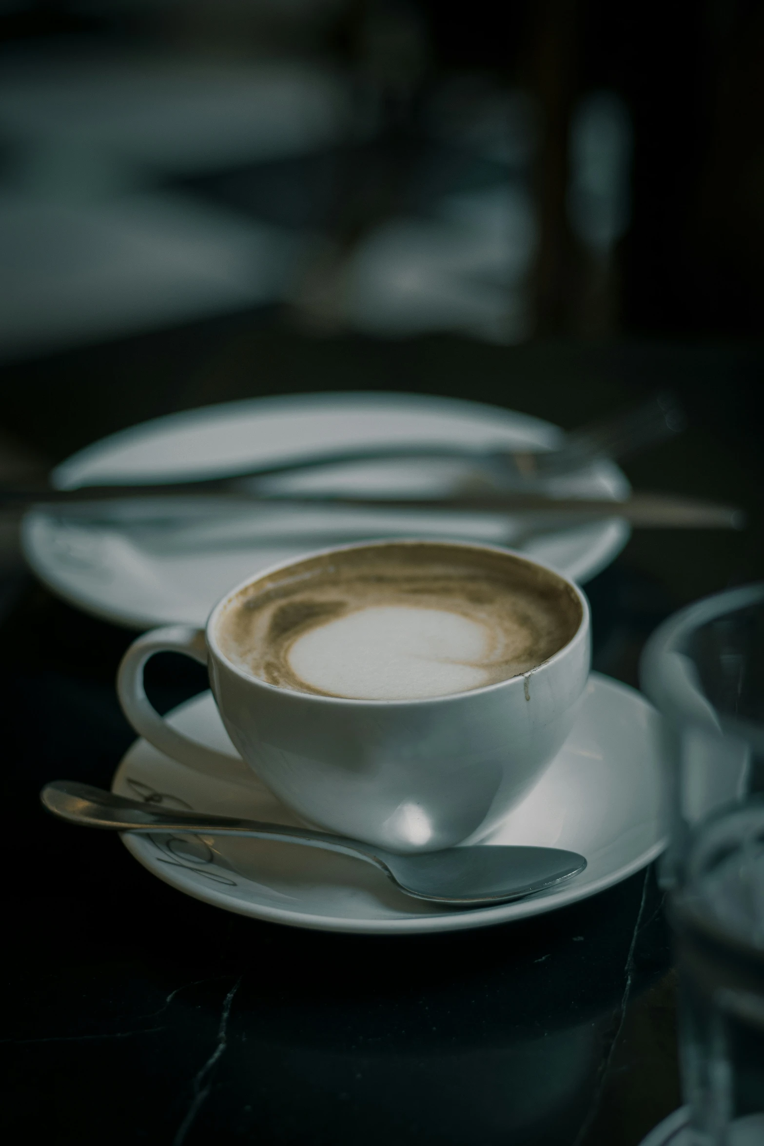 a cup and saucer sitting on a table