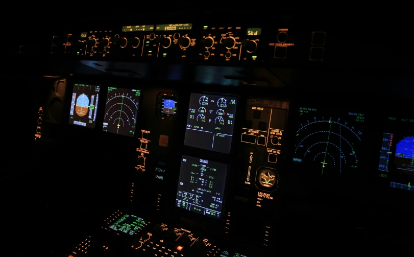 this is a display in an airplane with illuminated screens