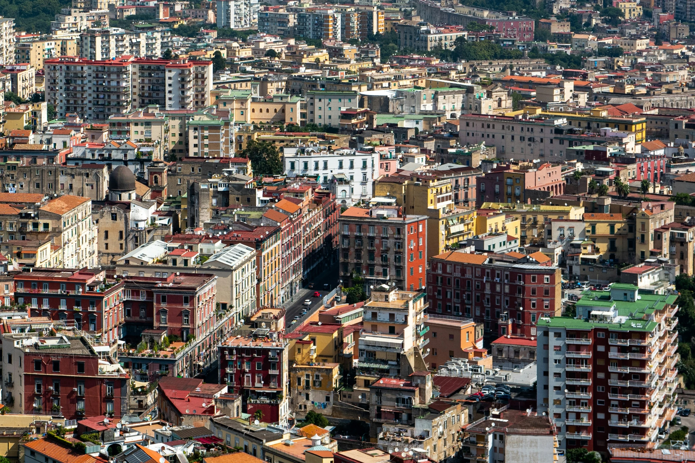 a group of large buildings next to a forest