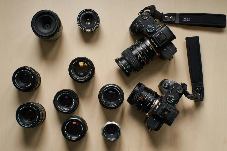 many different types of lens laying on a table