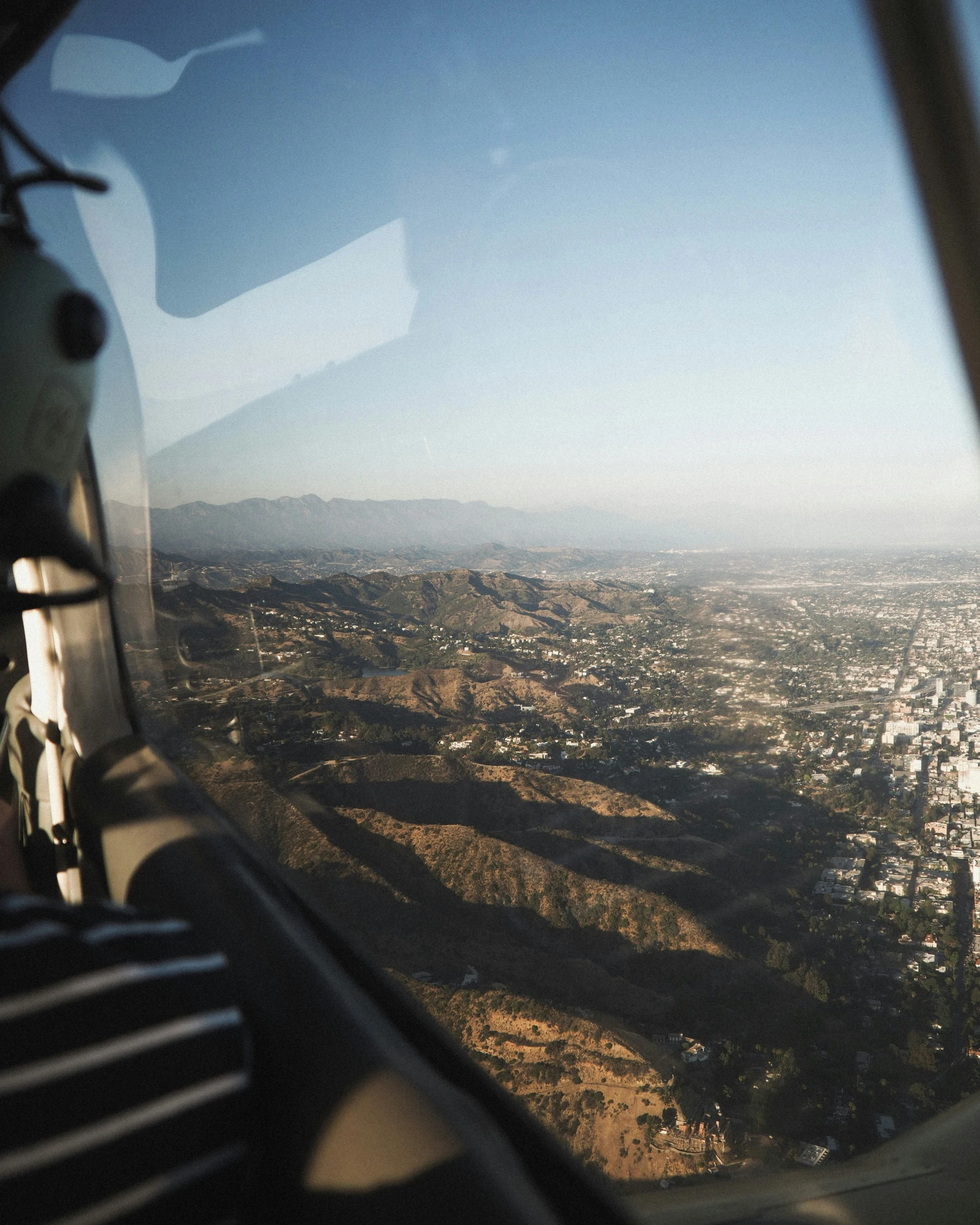 a view of the city from the inside a helicopter