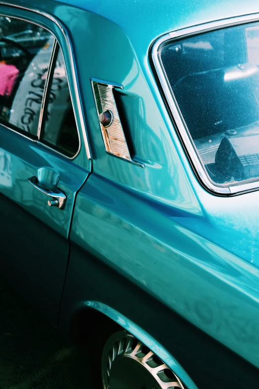 a green car is parked with its door open