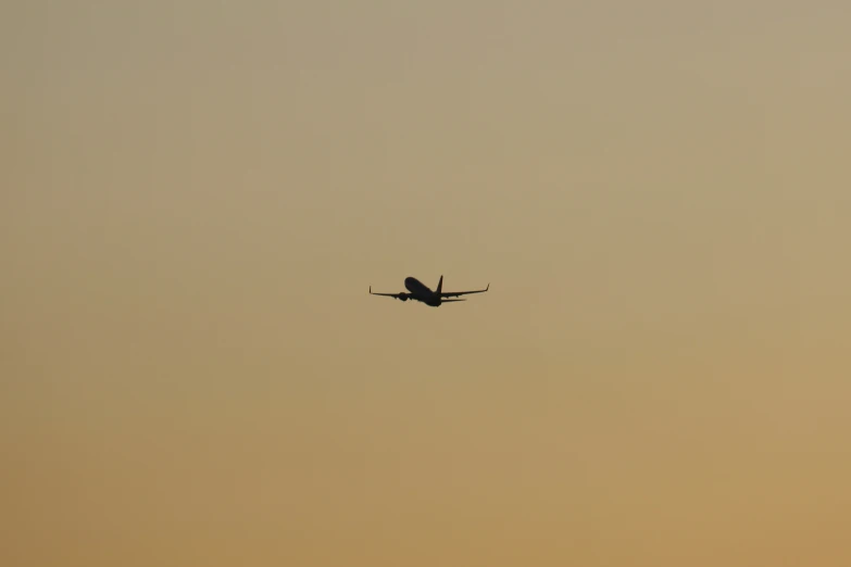 a large passenger jet flying in the sky