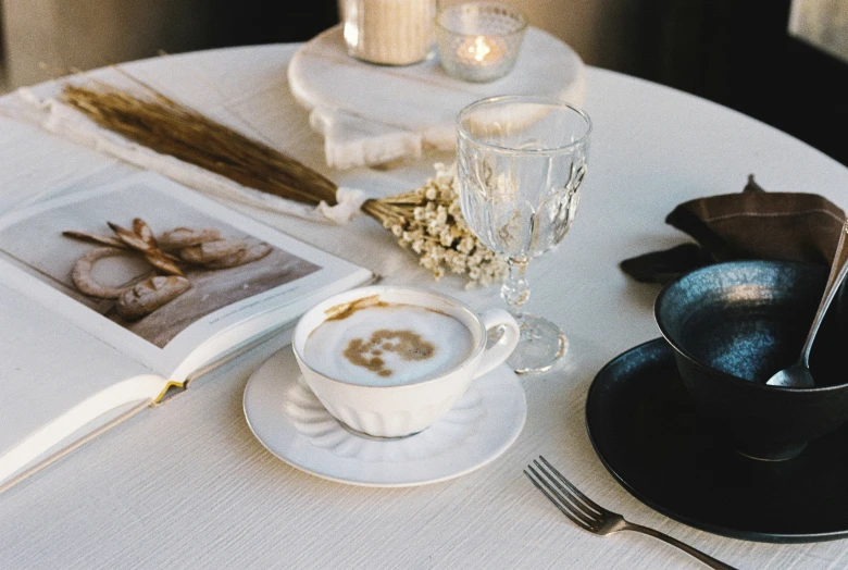 coffee and magazines are placed on a table