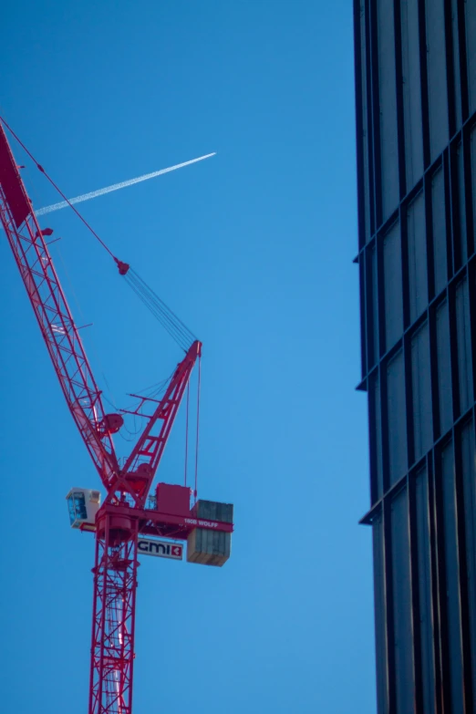 a crane is attached to the side of a building