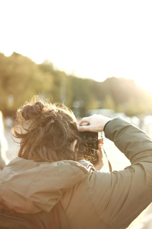 two people standing and one person is taking a picture