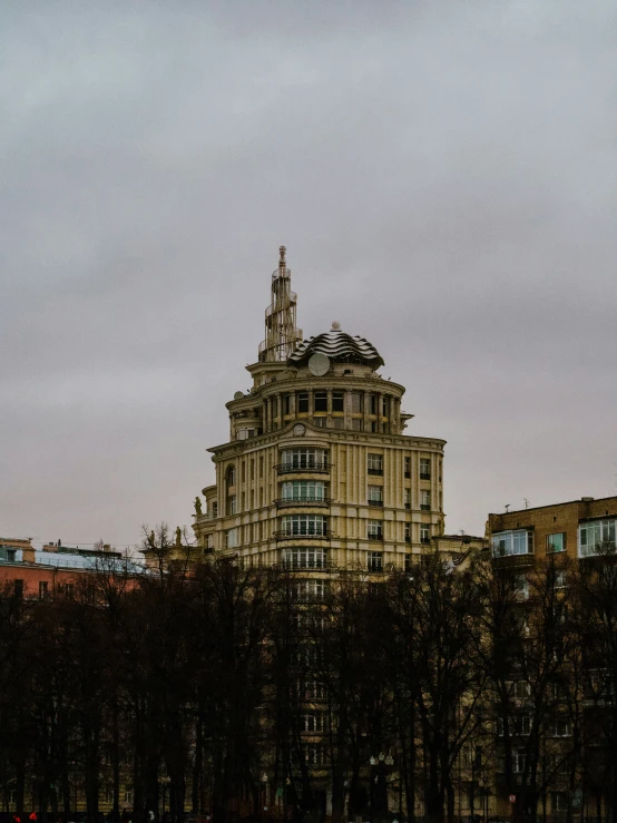 the view of a tall building from across a lake