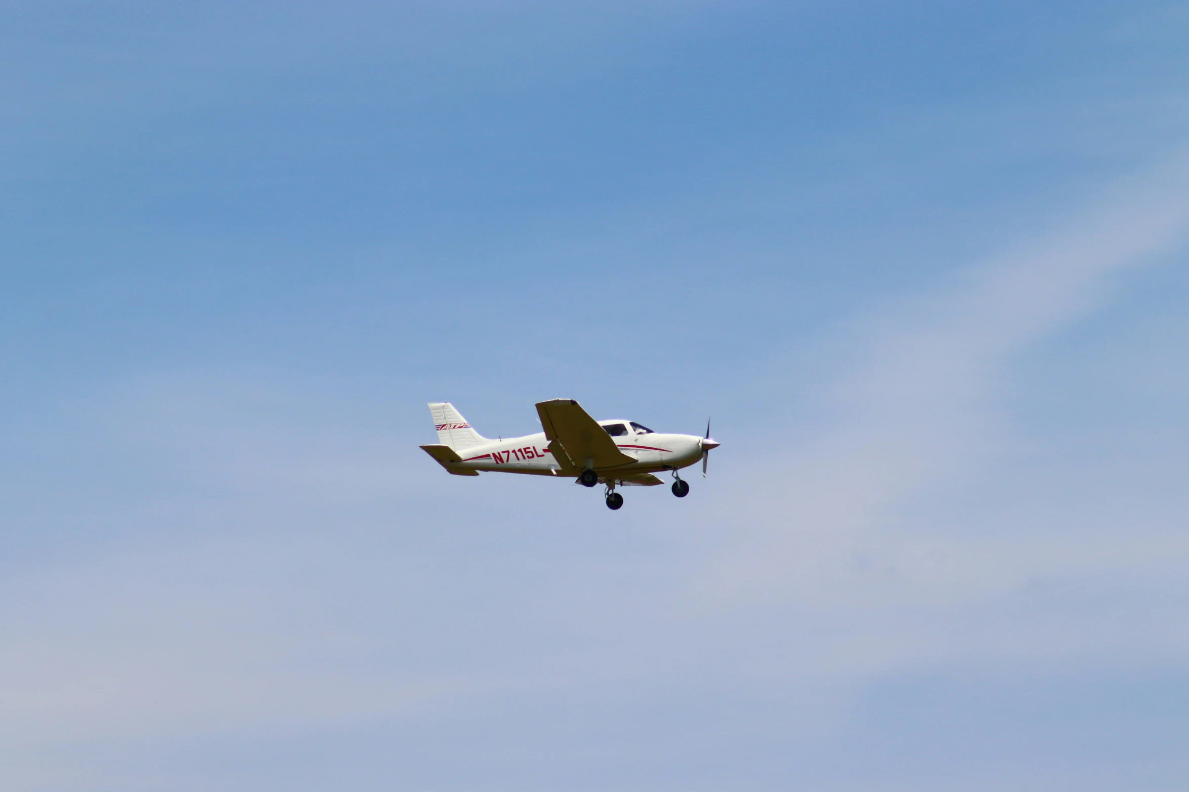 a small airplane in flight on a clear day