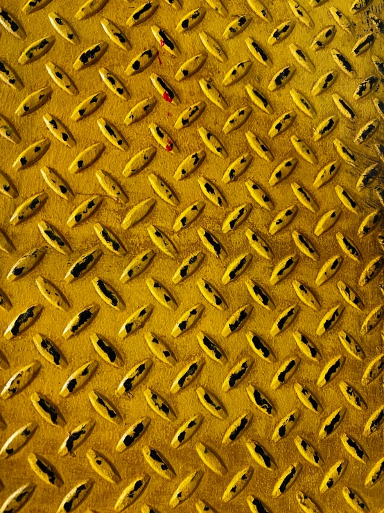 a yellow surface with lots of s and lines