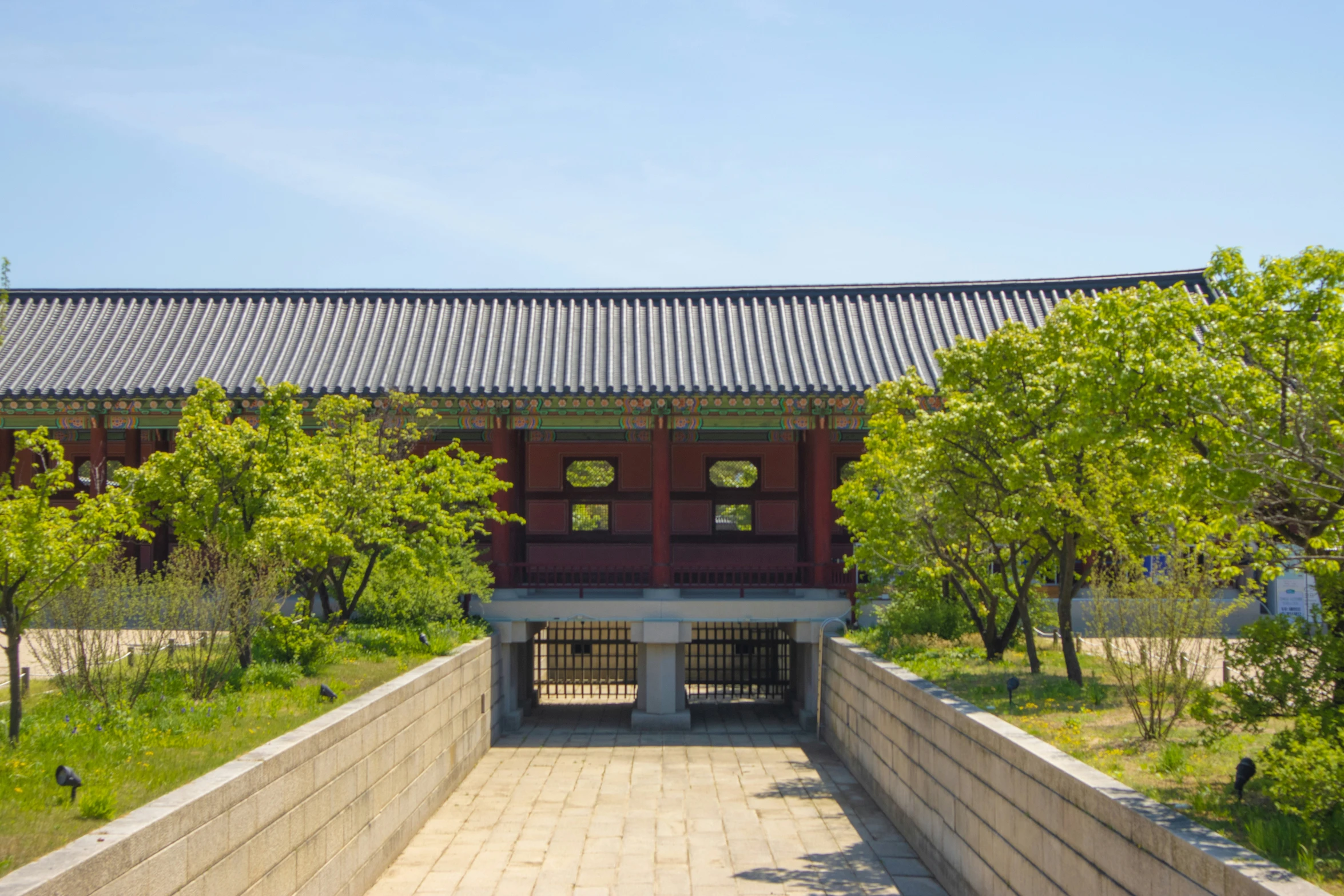 an outdoor building is seen through a park