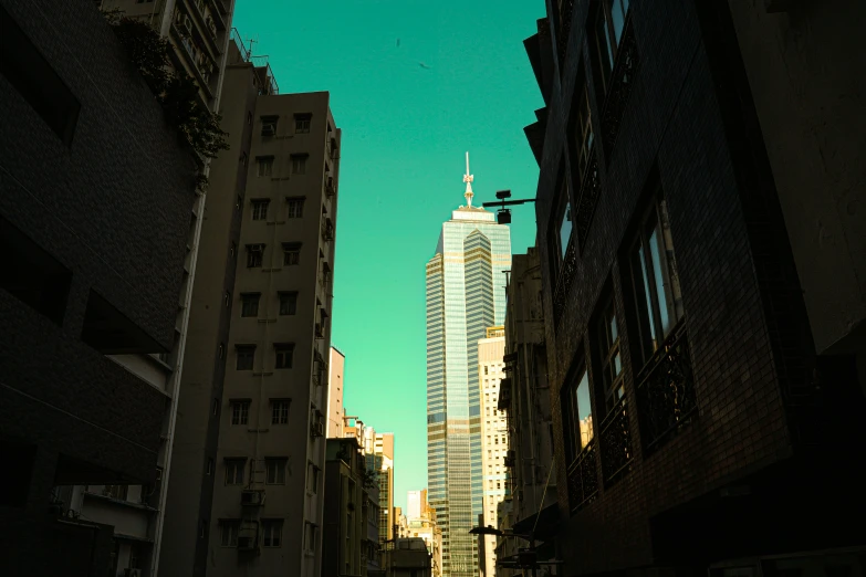 a very tall building towering over a city