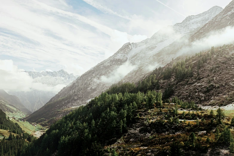 the tops of mountains are obscured by cloud and rain