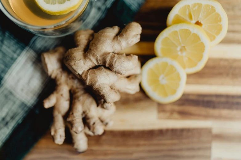 a bunch of ginnip and lemon on a  board