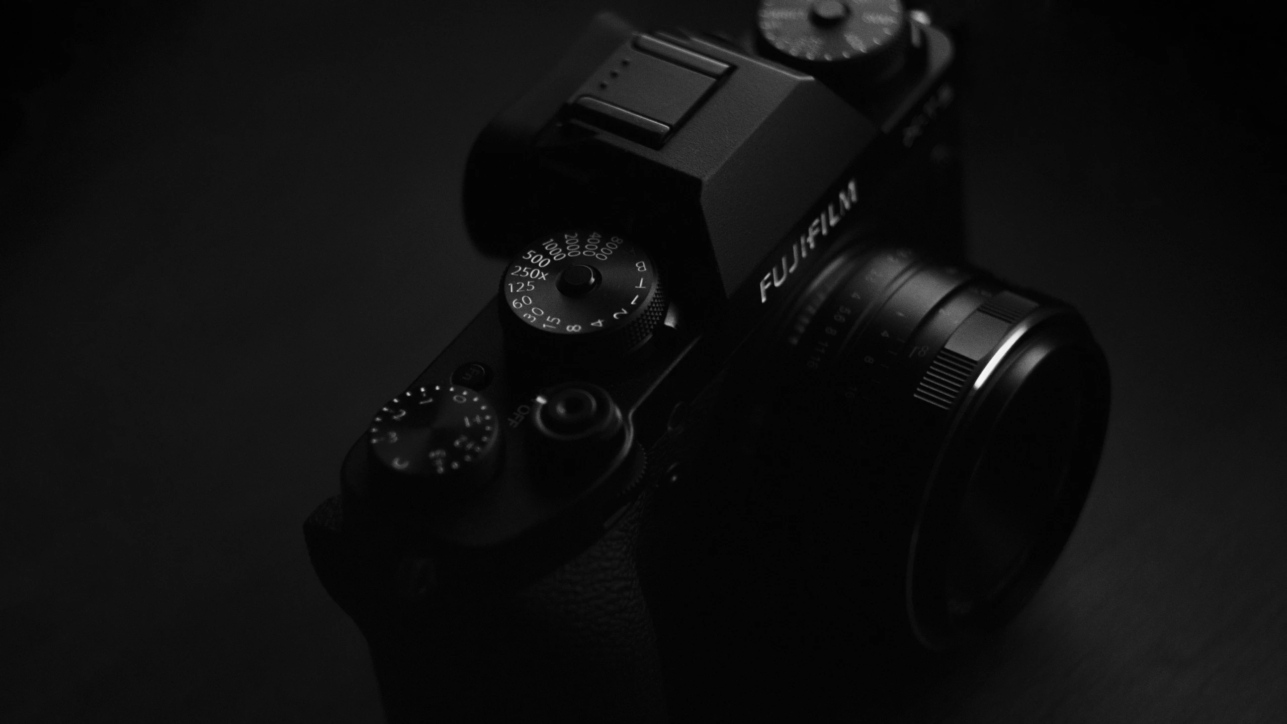 a camera on a table with the lens up close