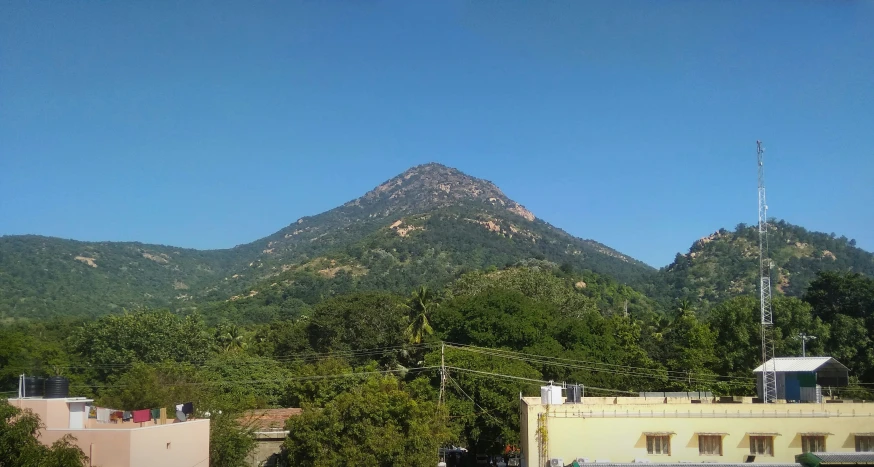 the view of some hills from a rooftop top