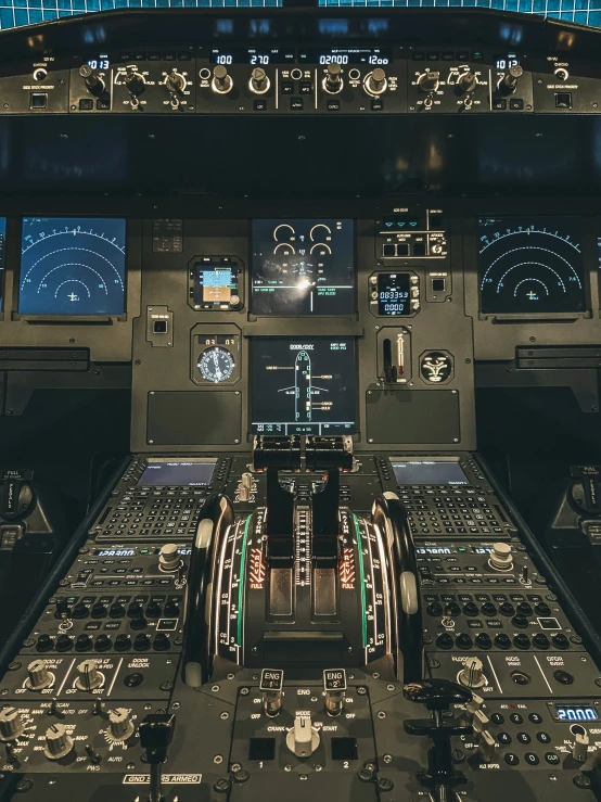 the inside of an airplane cockpit with several electronic displays