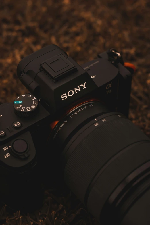 a sony camera and lens on a carpet