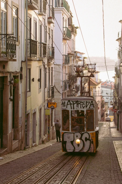 a street car driving down a busy city street