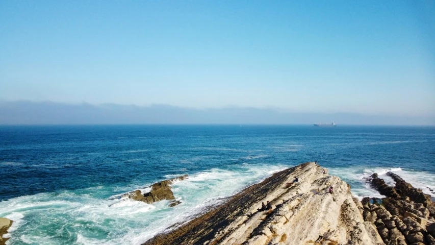 a cliff that has some water in it