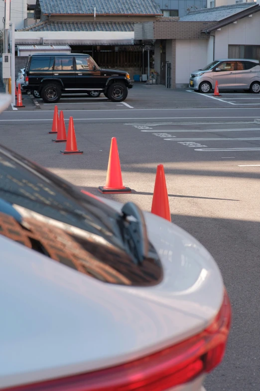 there are many orange cones in the parking lot