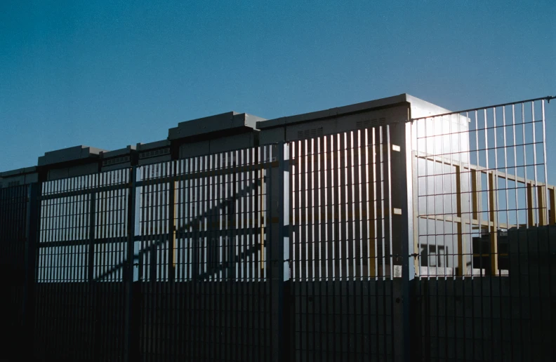 the gate and top of the building is made of metal