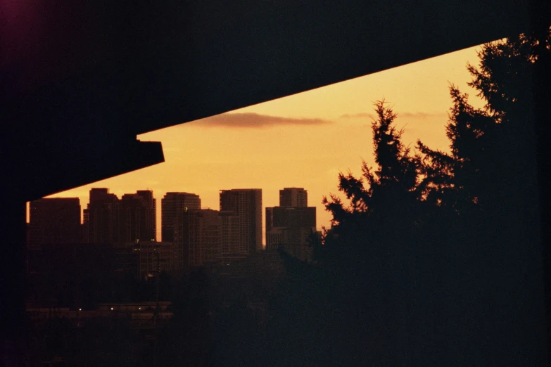 the view of a city at night through a window