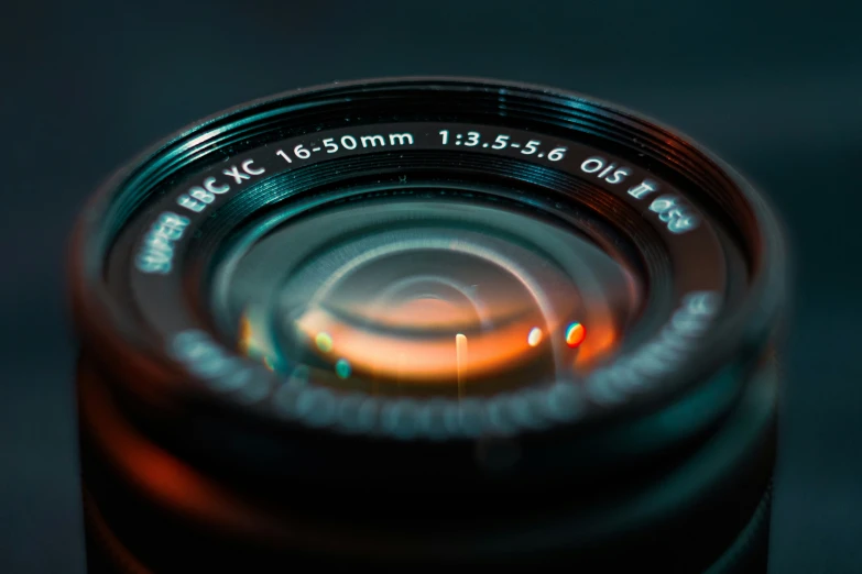 a camera lens is lit up on a table