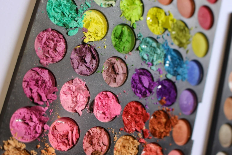 various color of powders arranged on a tray