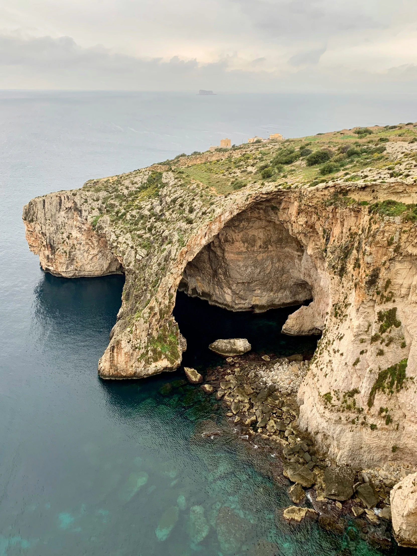 a large body of water with small rocky formations on either side of it