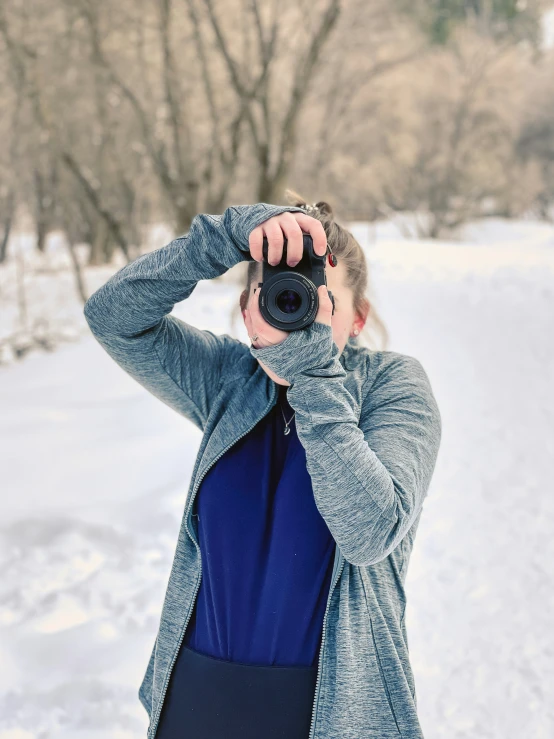 a person taking a po in the snow