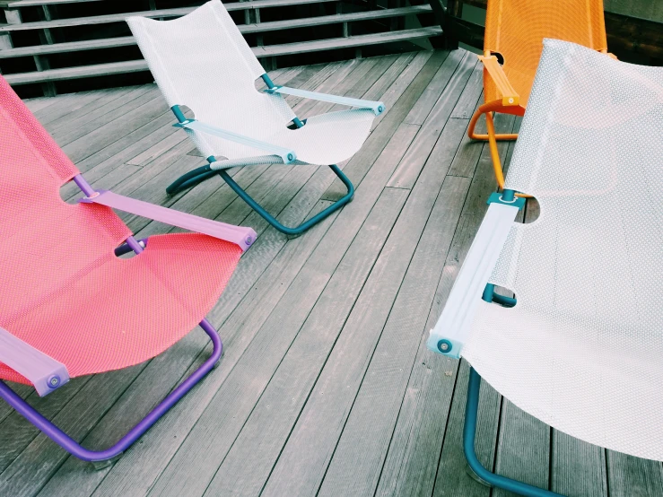 a couple of lawn chairs sitting next to each other