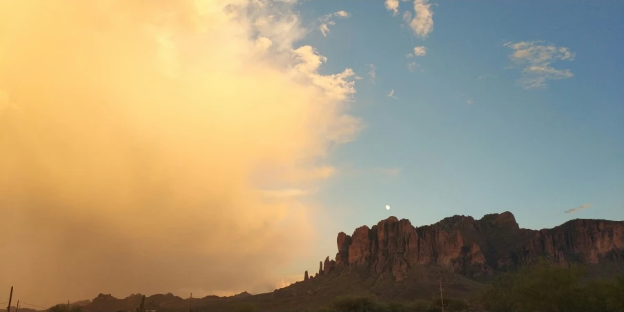 an image of the desert setting with a mountain behind it