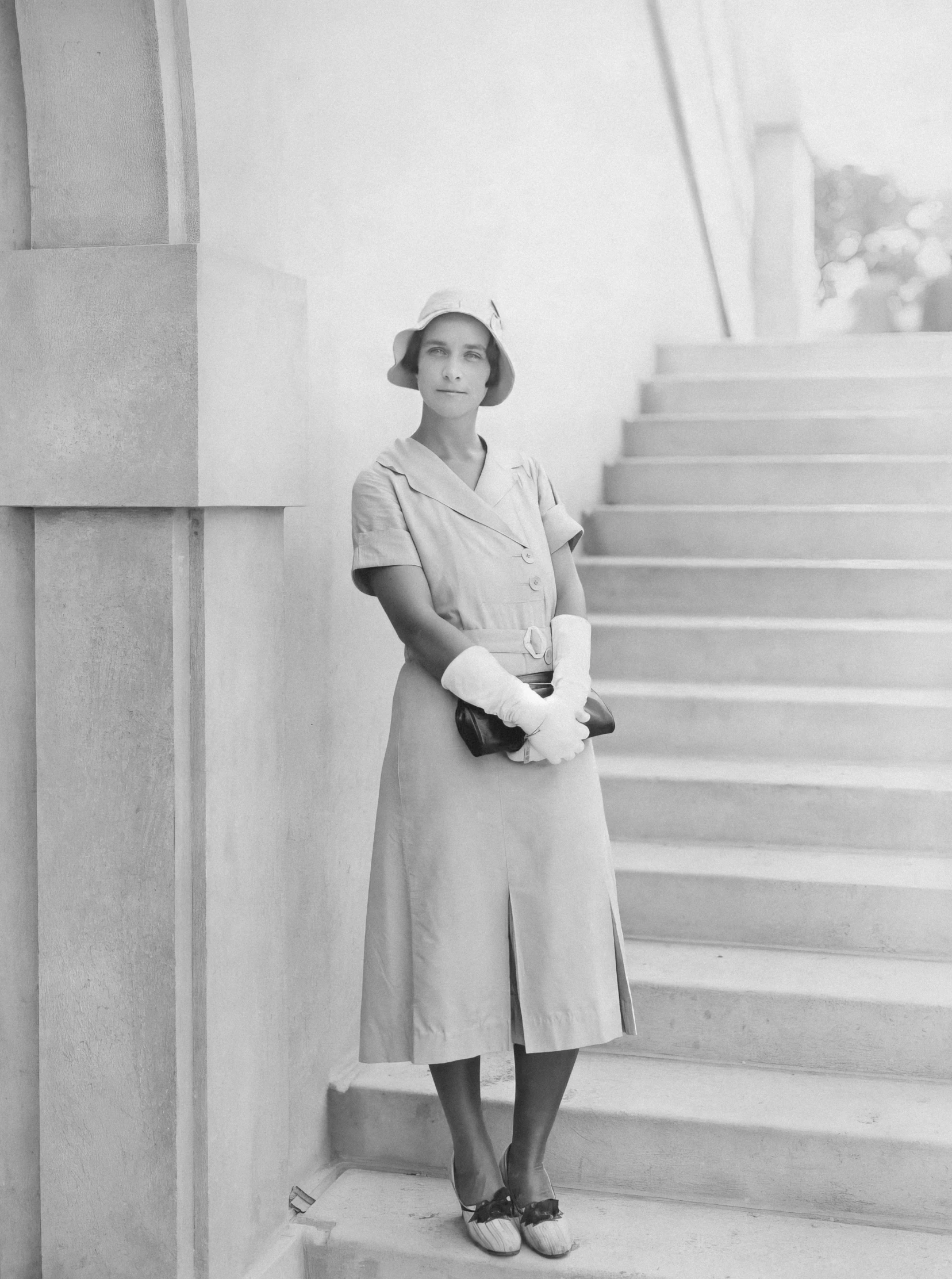 vintage nurse pograph of woman with castors standing on stairs