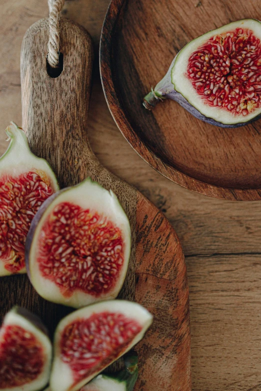 slices of fruit sit in an oval bowl