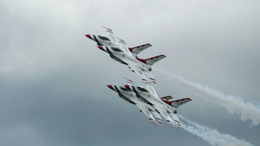 two jets flying side by side in the sky