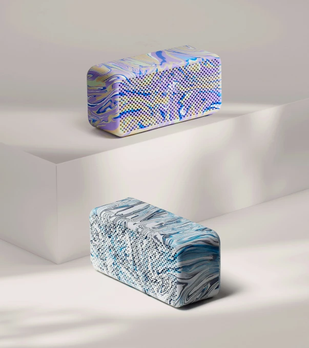 two blue and white patterned object sitting on top of each other