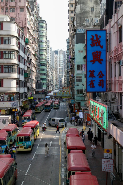 a group of buses and other traffic in an asian city