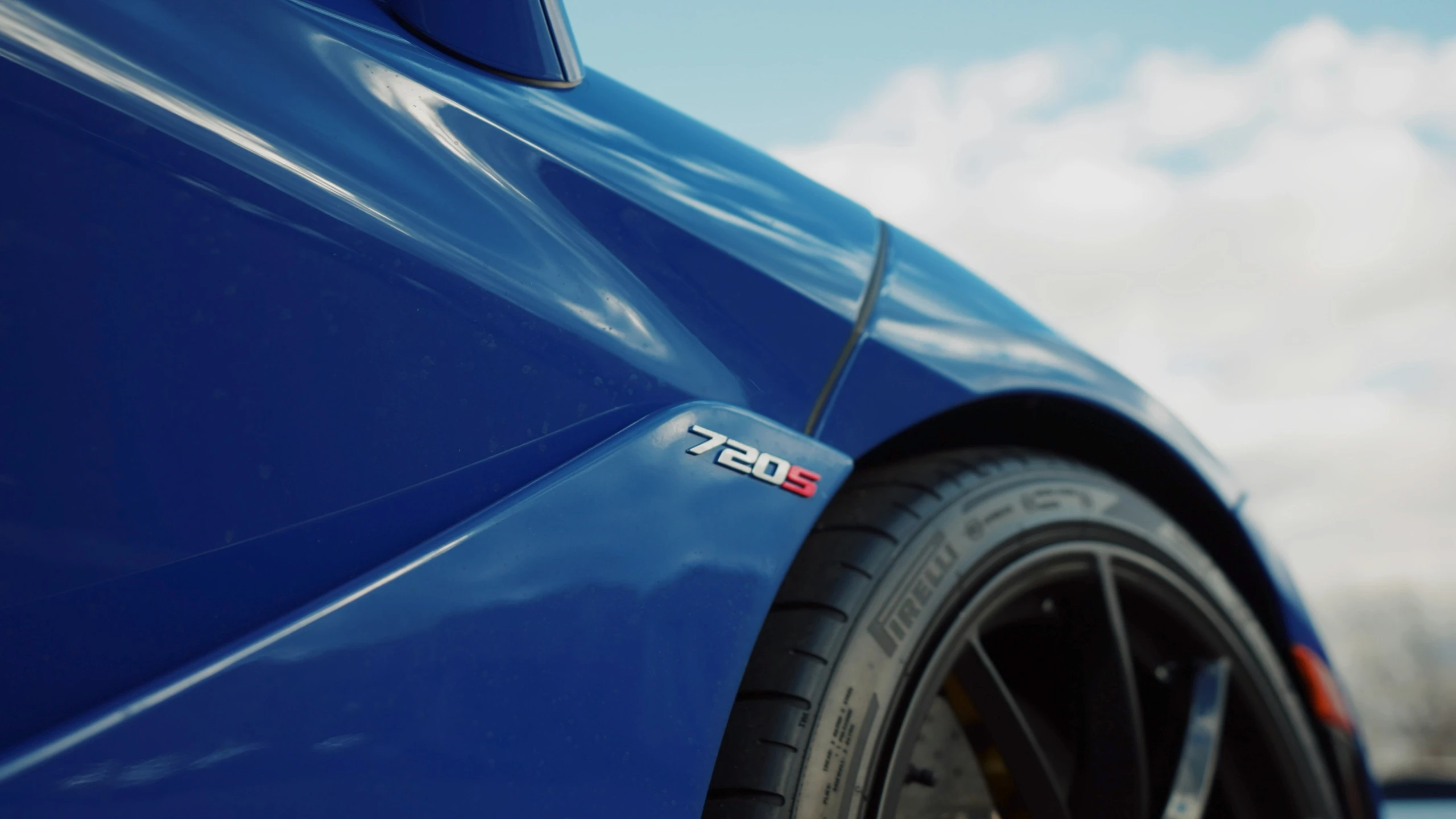 there is a close up view of a blue sports car