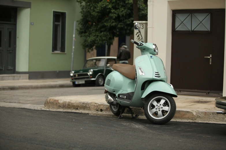 a scooter parked along a street corner