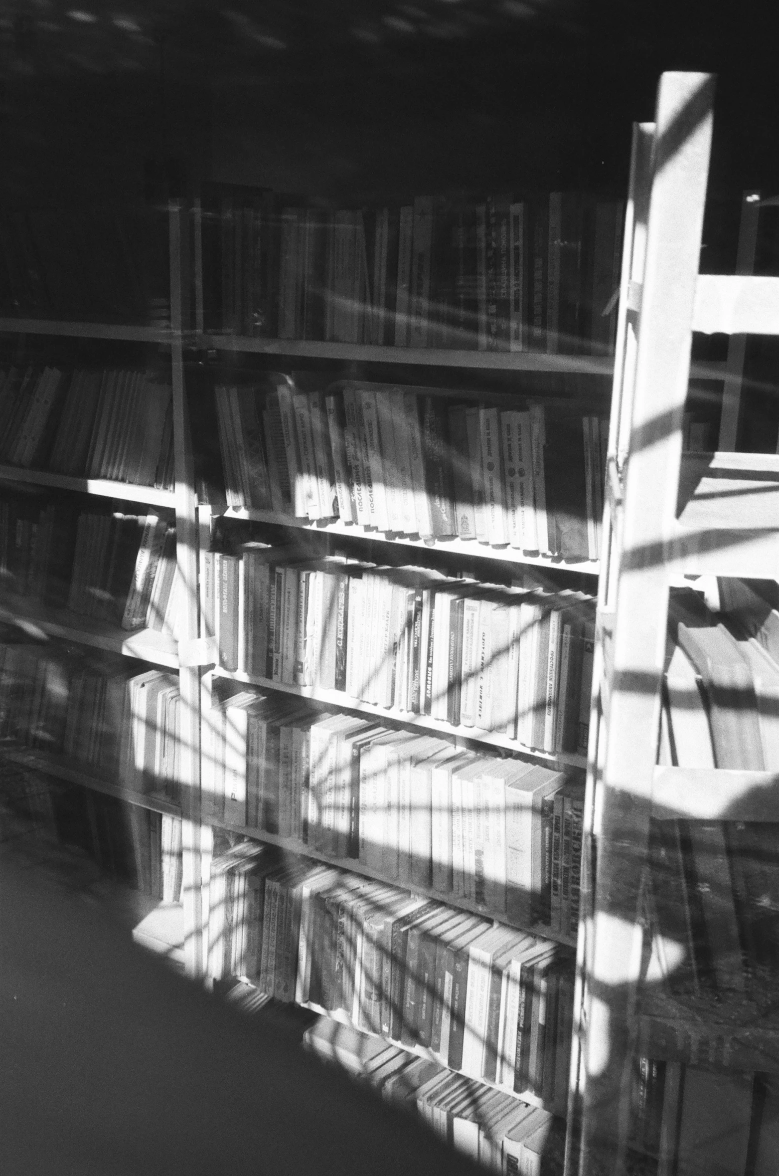 a bookshelf with a table and ladder