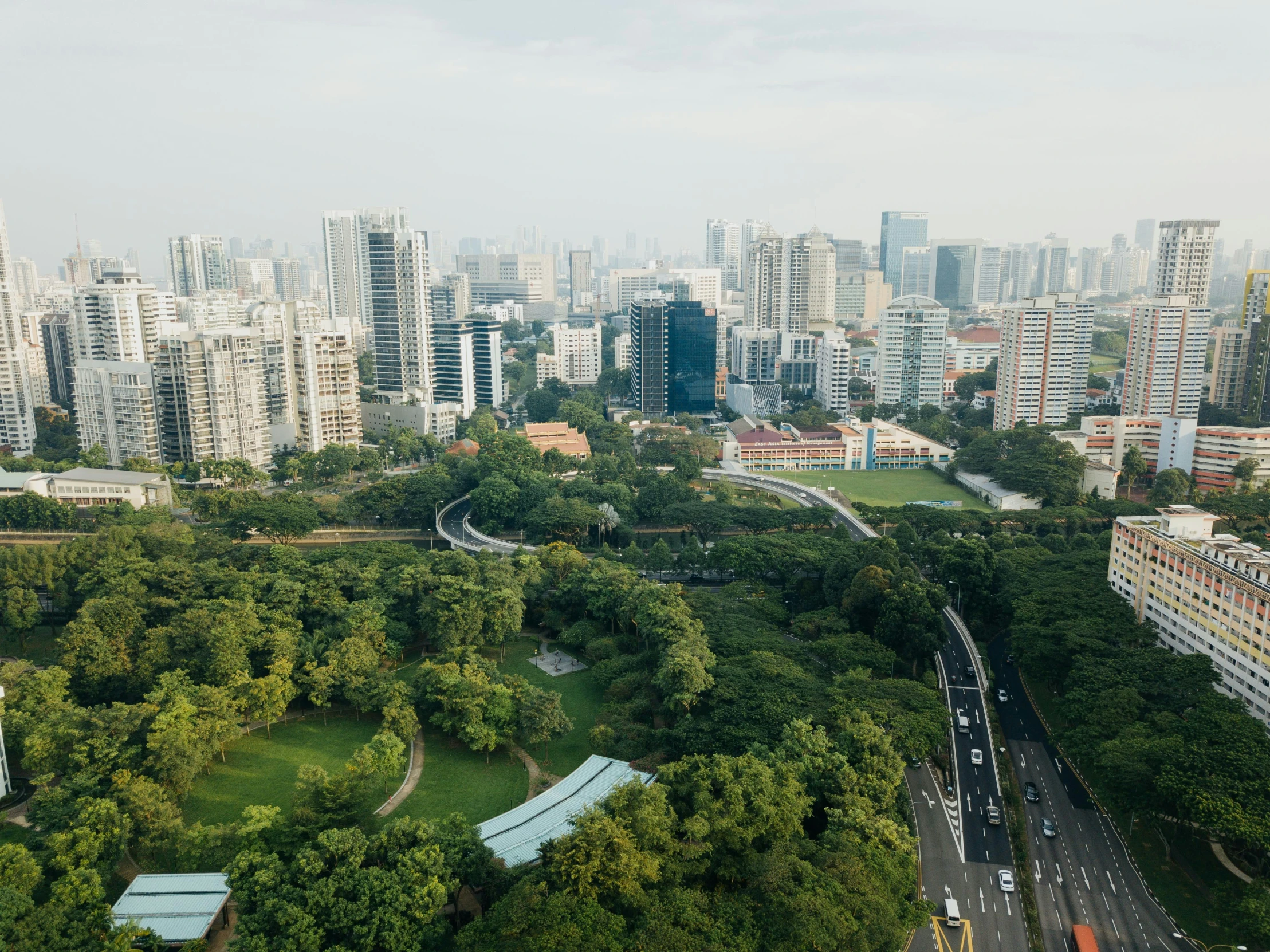 aerial view of an urban park with tall buildings