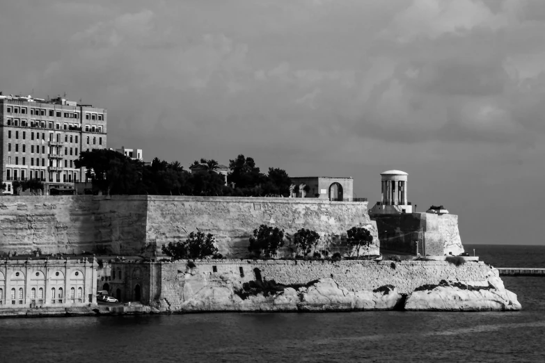 black and white image of a big city near the water