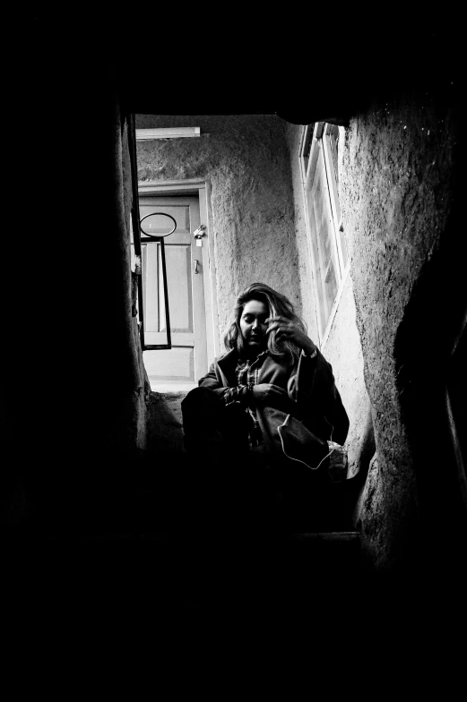 a man sitting on steps and looking up at the ceiling