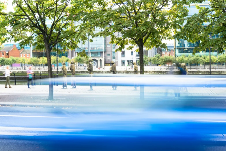 a man sitting at a bench looking out over a park