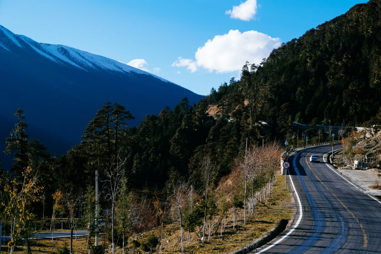 a street with a mountain in the background