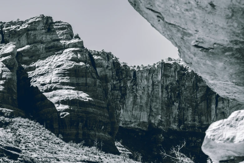 a rocky mountain is seen through the rock