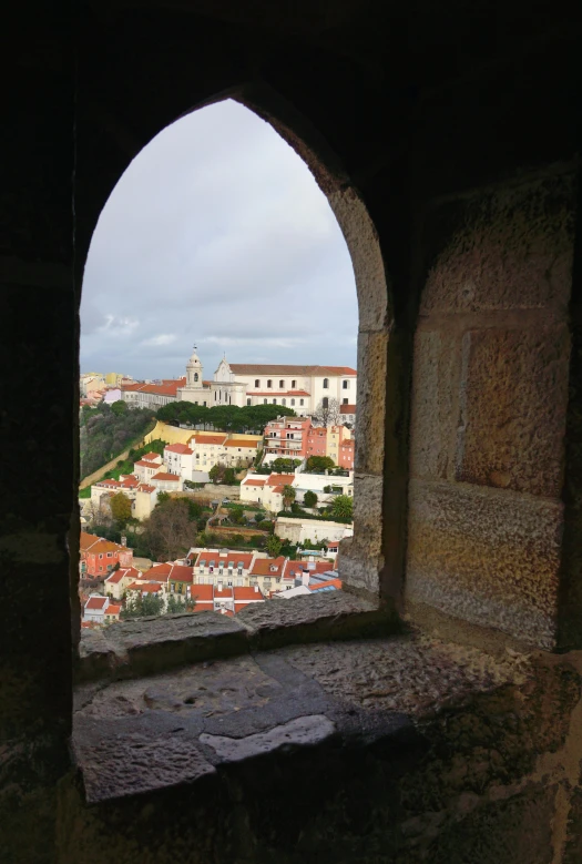 an arched window opens to the city and surrounding it