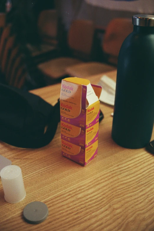 three drinks bottles on a table near one another