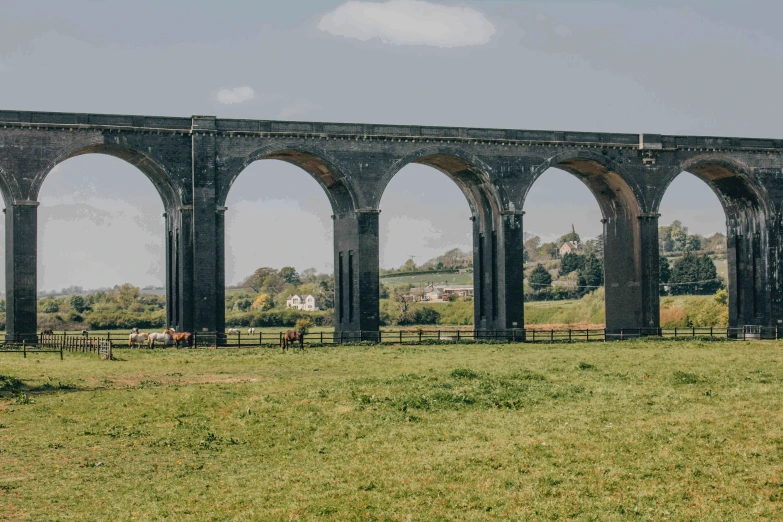 an old stone bridge with arches on the top of it